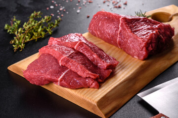 Fresh raw beef meat to make delicious juicy steak with spices and herbs