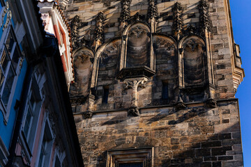Obraz premium Architectural parts of gothic Charles Bridge tower, Mostecka Street, stone carved art ornament detail, medieval ancient, Mala Strana or Lesser Town district, Prague, Czech Republic