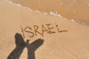 Inscription israel on the sandy beach