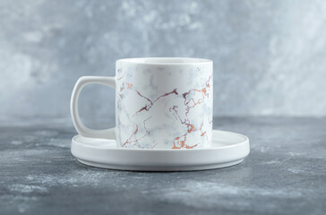 Cup of hot tea on marble background