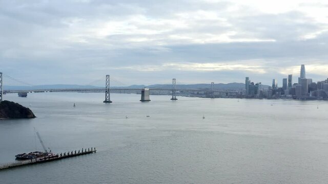 Aerial: Bay Bridge and San Francisco downtown, drone view