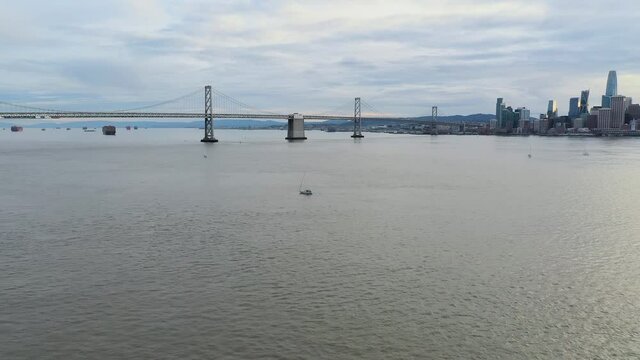 Aerial: a scenic vista of the city and the bridge, drone view