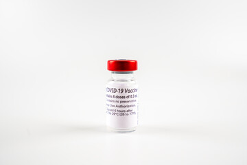 A corona covid-19 vaccine vial isolated on a white background. Pandemic and medial healthcare concept.