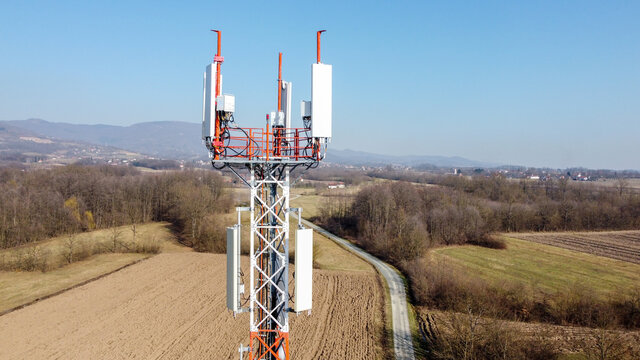 Aerial drone view of GSM and radio telecommunication tower. Cell phone tower. Base transceiver station. Wireless communication antenna transmitter.  