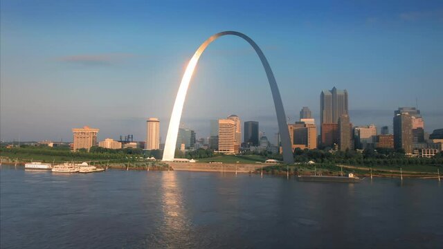 Aerial: The Gateway Arch, Mississippi River & downtown St Louis at sunrise. Missouri, USA