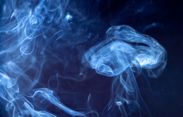 blue jet wave of smoke isolated on black background