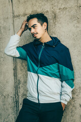Boy with blue jacket posing