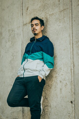 Boy with blue jacket posing