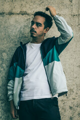 Boy with blue jacket posing