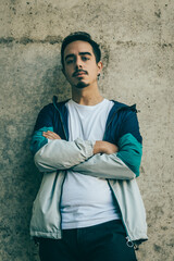 Boy with blue jacket posing