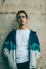 Boy with blue jacket posing