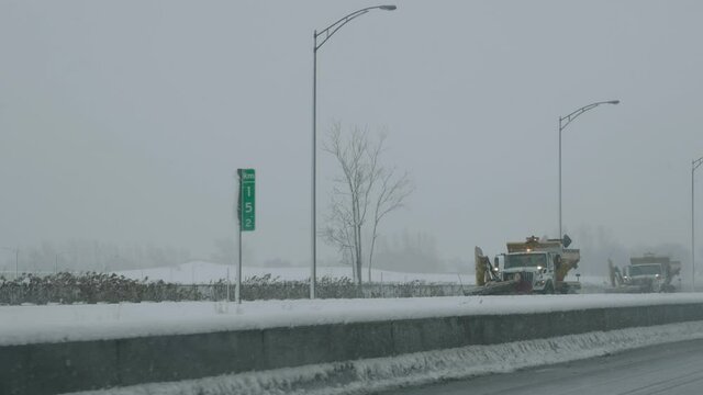 SNOW REMOVAL TRUCKS CLEAN ROADS