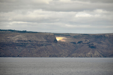 Bright Sunlit Spot under Thick Cloud Skies on Saint Helena Island