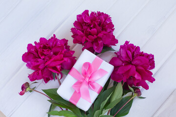 Bouquet of peony flower and gift box on the table. Birthday. mothers day, happy valentines day