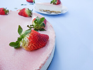 Creamy mascarpone cheese cake with strawberry . Piece of New York Cheesecake. Close up. Christmas dessert. Healthy food. Flat lay creative food concept.
