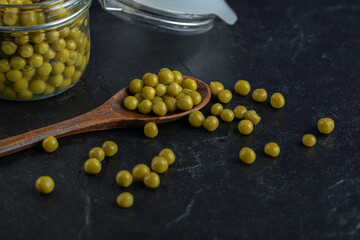 Close up photo of marinated olives on black background