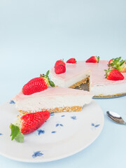 Creamy mascarpone cheese cake with strawberry . Piece of New York Cheesecake. Close up. Christmas dessert. Healthy food. Flat lay creative food concept.