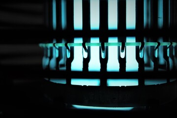 Blue glowing bug zapper closeup