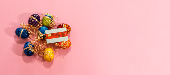 Top view of easter eggs and credit card.