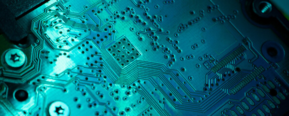 Close-up of electronic circuit computer microchips in neon colors