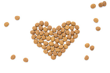 domestic animals dry food isolated on white background. dry cat feed cut out. above view. heart symbol
