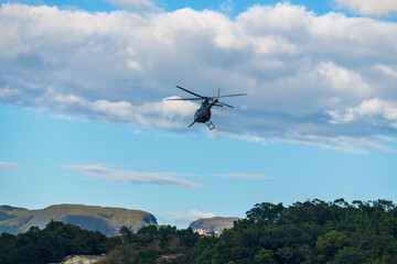 Fototapeta na wymiar A helicopter flying over the lagoon of Canaima National Park (Bolivar, Venezuela).
