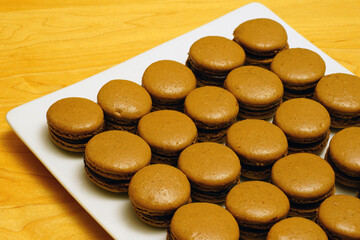 Obraz na płótnie Canvas French macaron cookies filled with chocolate ganache cream