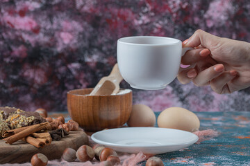 Chocolate cookies with nuts, cinnamon and anise served with a cup of tea