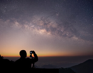 Fototapeta premium The stars and the milky way in the dark night sky are very beautiful.