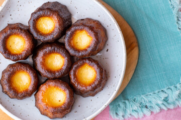 A plate of french pastries, Canelés de Bordeaux