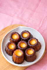 A plate of french pastries, Canelés de Bordeaux