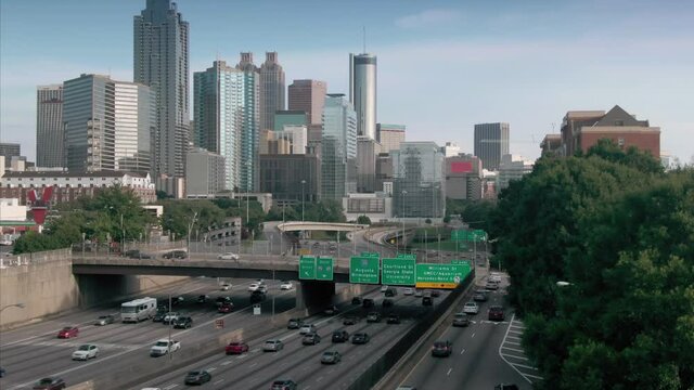 Aerial: Atlanta city skyline and freeway traffic. Georgia, USA
