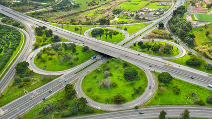 Drone view of cloverleaf interchange. Aerial view of highway road junction. Highway road in...