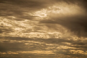 Naklejka na ściany i meble This photograph captures the beauty of a moody cloudy sky.