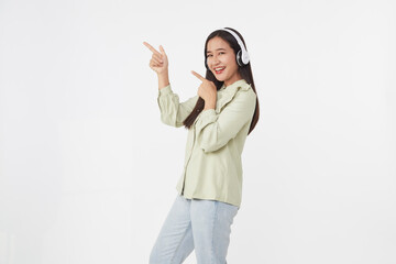 Joyful beautiful young Asian girl in headphones