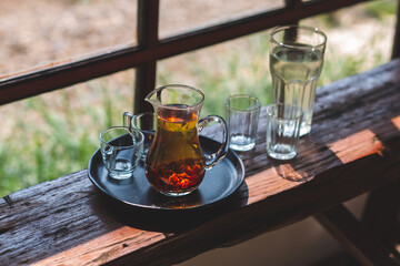 Drink hot tea in a beautifully prepared glass jug ready to serve.