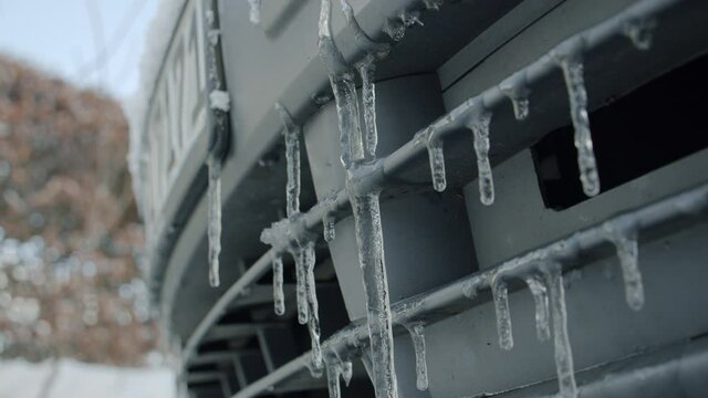 icicle`s on fronzen car front in winter