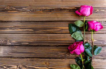 Fototapeta na wymiar Flat Lay, Flower layout Pink roses on wooden background