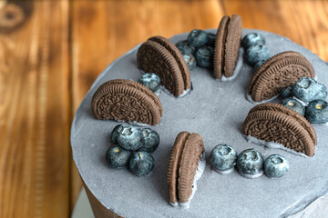 dark cake decorated with cookies
