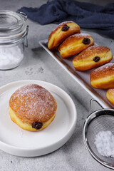 Donat bomboloni labu. Pumpkin bomboloni doughnuts with chocolate filling.
