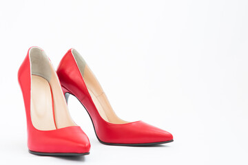 High-heeled shoes in red. Sexy shoes. White background. There is space for text