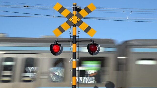 Railroad crossing warning and snowy mountains