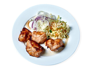 shish kebab with salad and onions on a white plate on a white background