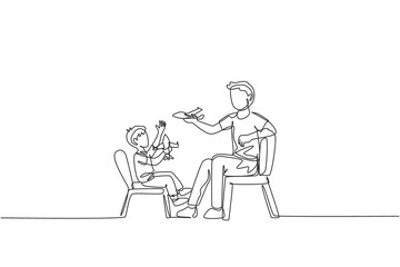 One single line drawing young dad and his son sitting on chair and playing airplane toy together at home vector graphic illustration. Happy family bonding concept. Modern continuous line draw design