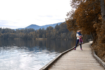 Mother and daughter having a good time on a lake.