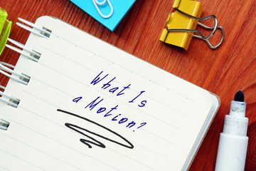 Legal concept about What Is a Motion? with phrase on the sheet.