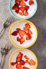 Milk dessert with ripe strawberries Healthy food dish, top view