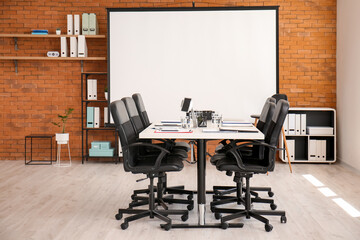 Room with projector prepared for conference in office