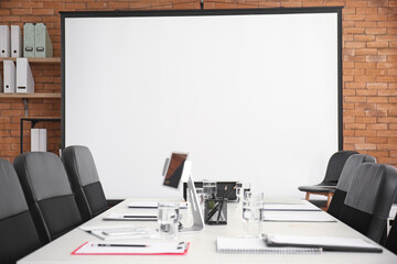 Room with projector prepared for conference in office