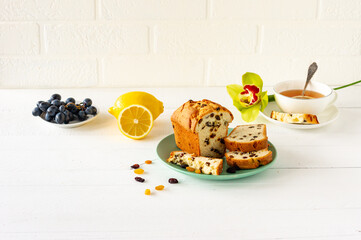 Homemade freshly baked cake loaf with raisins. Traditional treat for tea or coffee. Pound cake. Delicious breakfast.